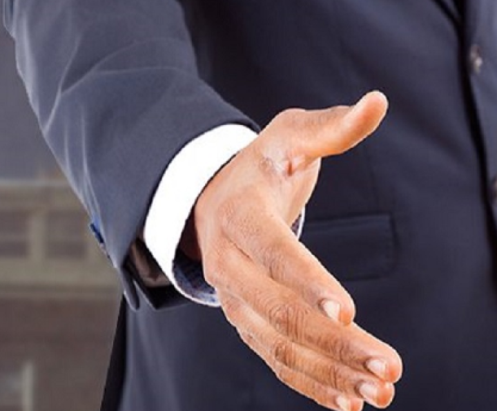A Man's Hand Reaching Out for a Handshake