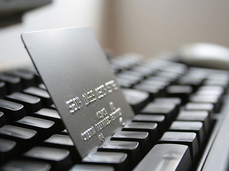 A Credit Card Nested on Top of a Keyboard
